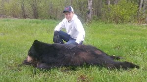 SK-180-young-hunter-with-first-bear-300x169  